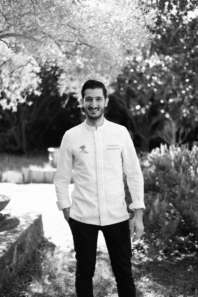 Portrait of chef Christophe Pulizzi in the garden of L’Olivier restaurant